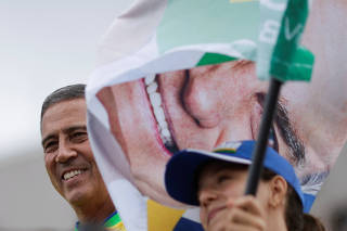 Vice presidential candidate Braga Netto attends a motorcade during an election campaign in Brasilia