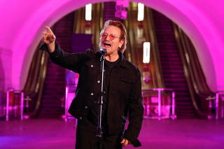 Bono sings during a performance for Ukrainian people inside a subway station in Kyiv