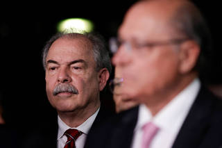 Brazilian politician Aloizio Mercadante reacts near Geraldo Alckmin, elected Vice President, during a news conference after meeting with senators at the Federal Senate in Brasilia