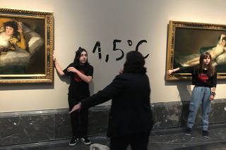 Climate protesters from Extinction Rebellion stick themselves to Goya's 