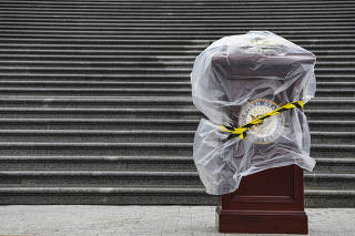 A podium is set up before a news conference on the steps of the U.S. Capitol in Washington, May 13, 2022. (Kenny Holston/The New York Times)