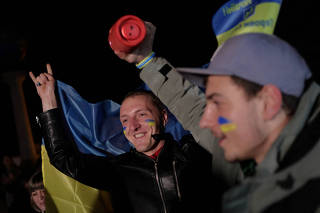 People celebrate after Russia's retreat from Kherson, in central Kyiv