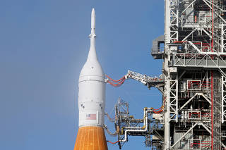 NASA's next-generation moon rocket, the Space Launch System (SLS) rocket with the Orion crew capsule, stands at launch complex 39-B as preparations continue for the Artemis 1 mission