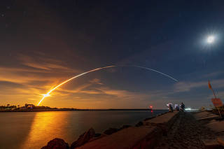 NASA's next-generation moon rocket, the Space Launch System (SLS) rocket with the Orion crew capsule, lifts off from launch complex 39-B, seen from Sebastian