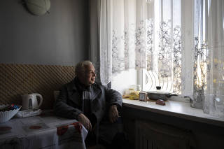 Timothy Morales, an American teacher, in the apartment he hid during Russia?s occupation of Kherson, Ukraine, on Nov. 15, 2022. (Lynsey Addario/The New York Times)