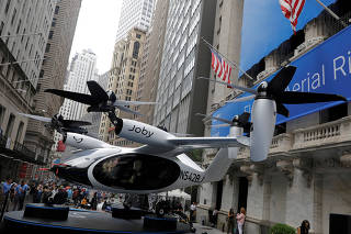FILE PHOTO: A Joby Aviation Air Taxi is seen outside of the New York Stock Exchange (NYSE) ahead of their listing in Manhattan, New York City