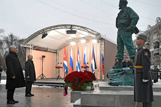Russian President Vladimir Putin and his Cuban counterpart Miguel Mario Diaz-Canel unveil a monument to Fidel Castro in Moscow