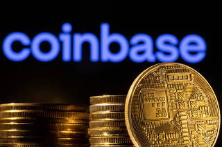 FILE PHOTO: Illustration shows a representation of cryptocurrency and Coinbase logo