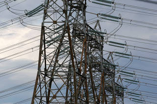 FILE PHOTO: High-tension electrical power lines are seen near the Golfech nuclear plant on the border of the Garonne River between Agen and Toulouse