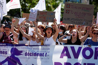 FILE PHOTO: Protesters gather for a rally in support of abortion rights in Paris