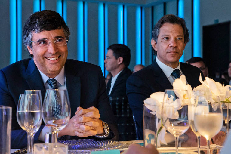 André Esteves, do BTG, e Fernando Haddad durante almoço da Federação Brasileira de Bancos, em São Paulo