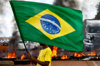 FILE PHOTO: Supporters of Brazil's President Jair Bolsonaro protest against President-elect Luiz Inacio Lula da Silva, in Planaltina