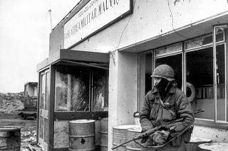 File photo of an Argentine army soldier guarding an air base in Puerto Argentino during the Falkland War