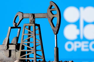 FILE PHOTO: A 3D-printed oil pump jack is seen in front of displayed OPEC logo in this illustration picture