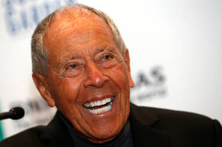 FILE PHOTO: Tennis coach Bollettieri laughs during news conference where he was introduced as one of the five new inductees to the International Tennis Hall of Fame in New York