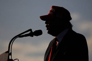 FILE PHOTO: Former U.S. President Donald Trump holds a rally ahead of the midterm elections, in Miami