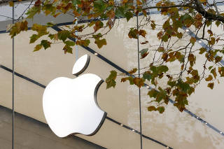 FILE PHOTO: The Apple Inc logo is seen at the entrance to the Apple store, in Brussels