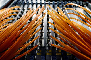 FILE PHOTO: Optical fibre cables are seen in a telephone exchange in Rome