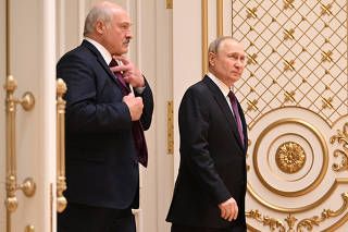 Russian President Vladimir Putin and Belarusian President Alexander Lukashenko attend a news conference in Minsk