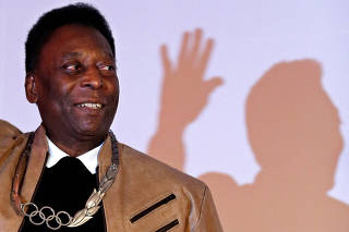 FILE PHOTO: Brazilian soccer legend Pele poses for a picture at the Pele Museum in Santos
