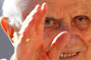 FILE PHOTO: Pope Benedict XVI waves as he leads his weekly audience in Saint Peter's Square at the Vatican