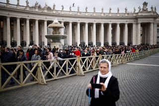 Faithful pay homage to former Pope Benedict in St. Peter's Basilica at the Vatican