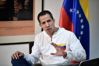 FILE PHOTO: Venezuelan opposition leader Juan Guaido speaks during an interview in Caracas