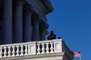 U.S. Capitol Police stand guard outside the Capitol buidling on a frigid day in Washington