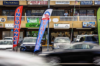 An insurance shop advertises Obamacare at a shopping center in Miami, Nov. 30, 2022. (Scott McIntyre/The New York Times)