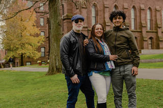 Ariel LaSalle, right, a high school senior from Goshen, N.Y., visiting Wesleyan University during the schoolÕs Fall Open House with his parents, in Middletown, Conn. on Nov. 11, 2022. (Bea Oyster/The New York Times)