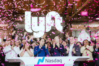 Lyft co-founders John Zimmer, center left, and Logan Green, center right, at the companyÄôs IPO party on Friday, March 29, 2019, in Los Angeles.