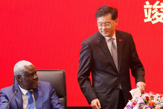 China's Foreign Minister Qin Gang and the African Union Commission (AUC) Chairperson, Moussa Faki arrive to address delegates at the inauguration of the new Africa Centres for Disease Control and Prevention headquarters in Addis Ababa