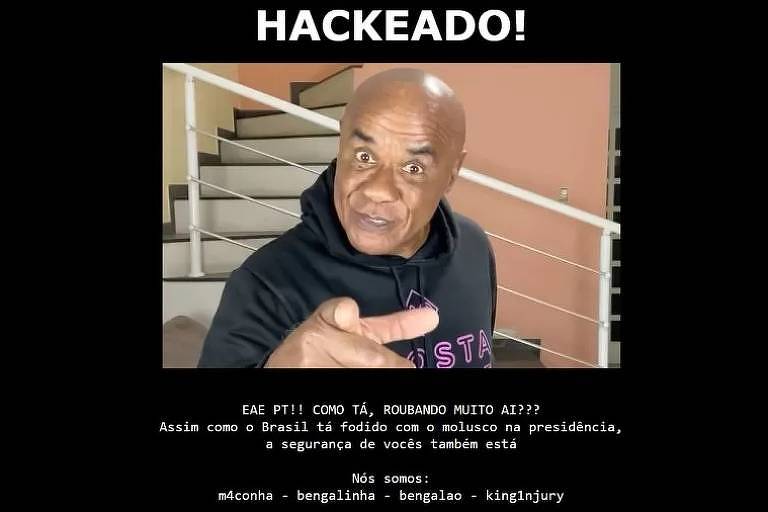 Em um fundo preto, há a foto do ex-ator pornô Kid Bengala. No alto, está está escrito: hackeado!