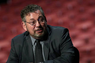 FILE PHOTO: James Dolan speaks at news conference from the stage at Radio City Music Hall in New York
