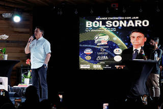 Former Brazilian President Jair Bolsonaro attends an event taking place in a restaurant at Dezerland amusement park in Orlando
