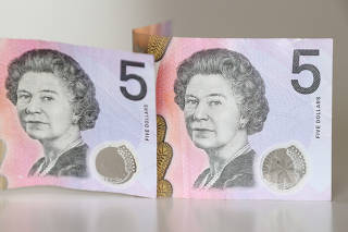 A picture illustration of Australian $5 banknotes with the late Queen Elizabeth II displayed