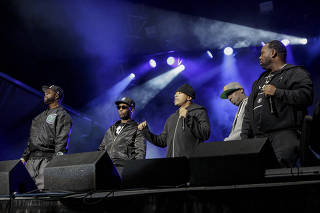 The Wu-Tang Clan performs with The Roots during The Roots Picnic at Bryant Park in New York.