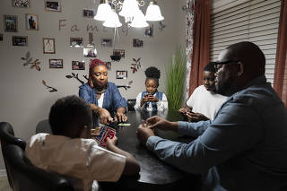 Athenia Rodney, her husband, Kendall, and their three children, who moved away from New York City last summer, at their new home in Snellville, Ga., Jan. 22, 2023. (Nicole Craine/The New York Times)