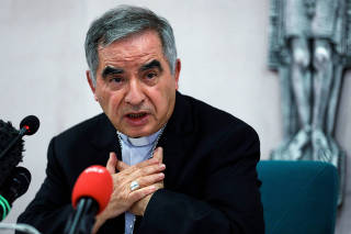FILE PHOTO: Cardinal Giovanni Angelo Becciu speaks to the media in Rome