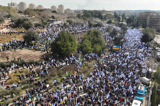 Israelis demonstrate on the day Israel's constitution committee is set to start voting on changes that would give politicians more power, in Jerusalem