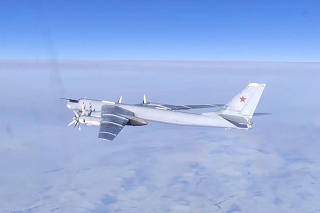 Russian Tu-95MS strategic bomber performs a flight over the neutral waters of the Bering Sea