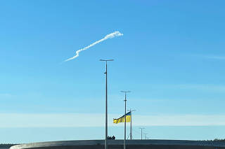 A missile trace is seen in a sky near Kyiv