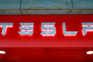 FILE PHOTO: The logo of U.S. car manufacturer Tesla is seen in Zurich