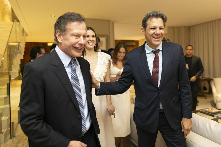 O empresário João Camargo, presidente do conselho do grupo Esfera, e o ministro da Fazenda, Fernando Haddad