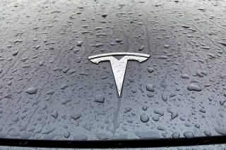 FILE PHOTO: FILE PHOTO: A view shows the Tesla logo on the hood of a car in Oslo