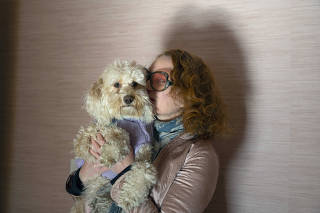 Lola Star and her dog, Dazzle, who has gotten into joints left on the ground many times, at theeir home in Brooklyn on Feb. 4, 2023. (Calla Kessler/The New York Times)