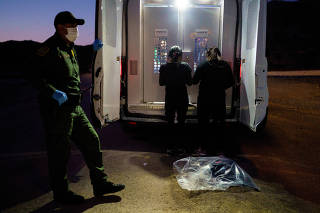 FILE PHOTO: Two Ecuadorian women are processed by a U.S. Border Patrol agent after they crossed the border from Mexico into Sunland Park