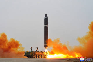 FILE PHOTO: A Hwasong-15 intercontinental ballistic missile (ICBM) is launched at Pyongyang International Airport