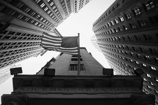 A U.S. flag is seen outside the New York Stock Exchange (NYSE) in New York City
