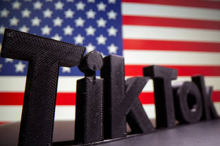 FILE PHOTO: A 3D printed Tik Tok logo is seen in front of U.S. flag in this illustration